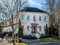 Stunning two-story white brick home with a classic design at 2900 Glenanneve Pl, Raleigh, NC 27608
