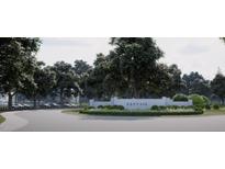 Gated entrance to the Cattail community featuring landscaping and signage at 148 Charlotte Knoll St # 8, Zebulon, NC 27597