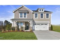 Two-story home with gray siding, white trim, and a two-car garage at 178 Charlotte Knoll St # 9, Zebulon, NC 27597