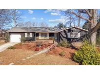 Charming single-story home with a well-maintained front yard and inviting covered porch at 1219 Carlton Ave, Burlington, NC 27217