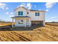 Two-story white house with attached garage and unfinished landscaping at 3655 Nc-62, Burlington, NC 27217