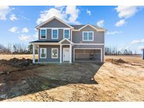 Two-story house with gray siding, white trim, and a two-car garage at 3689 Nc 62, Burlington, NC 27217