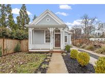 Charming craftsman style home with a gray exterior and a welcoming front porch at 520 S Bloodworth St, Raleigh, NC 27601