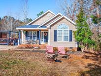 Charming ranch home with a landscaped yard and deck at 10 Flume, Franklinton, NC 27525