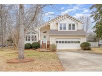 Charming two-story home with a two-car garage and well-maintained landscaping at 1110 Cedar Ridge Dr, Mebane, NC 27302