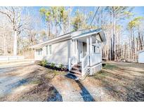 Cute cottage with front porch and wood siding at 902 Cobb Ct, Sanford, NC 27330