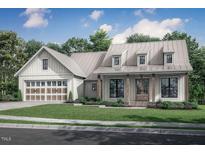 Craftsman style home with metal roof, two-car garage, and front porch at Lot 8H Green Downs Trl, Spring Hope, NC 27882