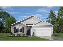 One-story home with gray siding, stone accents, and a two-car garage at 1113 Middlecrest Dr, Rocky Mount, NC 27804