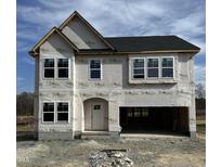New two-story home boasts black roof, white windows, and a spacious two-car garage at 364 Pecan Valley Way, Four Oaks, NC 27524