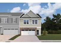 Two-story townhome with gray siding, stone accents, and a two-car garage at 7119 Hubner Pl # 23, Cary, NC 27519