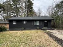 Newly renovated black brick ranch home with a spacious yard at 905 Corona St, Durham, NC 27707