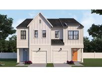 Stunning duplex featuring white siding, black roof, white garage doors, and colorful front doors at 935 Selby Ave, Durham, NC 27713