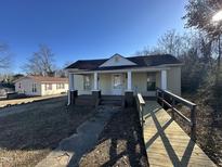 Charming single-story home with a welcoming front porch and accessible ramp at 1118 Boyer St, Raleigh, NC 27610