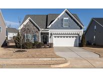 Craftsman style home with stone accents and a two-car garage at 121 Belleforte Park Cir, Garner, NC 27529