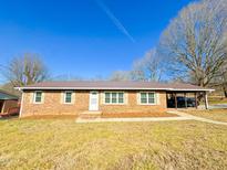 Brick ranch house with carport and landscaped yard at 314 Lawrence Street St, Roxboro, NC 27573