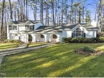 White two-story house with a large front yard and driveway at 3872 Hope Valley Rd, Durham, NC 27707