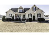 Suburban home with vinyl siding and a landscaped yard at 3977 Baybrook Rd, Nashville, NC 27856