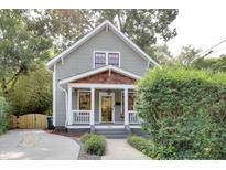 Gray craftsman home with front porch and landscaped yard at 709 S Boylan Ave, Raleigh, NC 27603