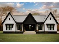 Stunning modern farmhouse with black and white exterior, landscaping, and large windows at Lot 18H Good Shepherd Trl, Spring Hope, NC 27882