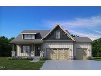 Two-story house with a three-car garage, stone accents, and a landscaped yard at 152 Boyce Ct, Sanford, NC 27332