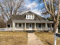 Charming one-story house with a front porch and well-maintained lawn at 809 Wicker St, Burlington, NC 27217