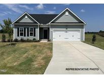New single-story home with gray siding, white trim, and a two-car garage at 45 Mossman Ct, Zebulon, NC 27597