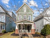 Charming two-story craftsman home with brick accents and a welcoming front porch at 2260 Dunlin Ln, Raleigh, NC 27614