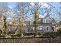 Charming two-story home with a metal roof and mature trees at 806 E Franklin St, Chapel Hill, NC 27514