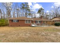 Brick ranch house with ramp access and a spacious yard at 1113 W Mount Dr, Rocky Mount, NC 27803