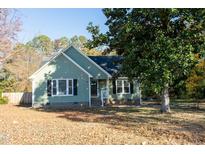 Green house with black shutters and landscaping at 248 Southgate Dr, Garner, NC 27529