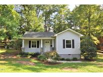 Charming gray house with stone accents and a manicured lawn at 326 Webster St, Cary, NC 27511