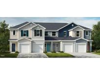 Three-unit townhome building, featuring modern design and attached garages at 520 Eastwood St, Durham, NC 27704