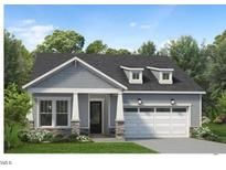 Attractive craftsman style home with gray siding, stone accents, and a two-car garage at 632 Gainer Dr # 19, Raleigh, NC 27610