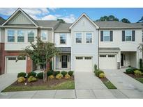 Charming townhome featuring a front yard, a single-car garage, and a well-maintained lawn at 3836 Prince Noah Loop, Wake Forest, NC 27587
