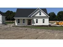 Charming new construction home with classic white siding and a covered front porch at 3963 Baileys Xrds Rd, Benson, NC 27504