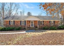 Charming single-story brick home with a covered front porch and traditional design elements at 132 Cheryl Ave, Durham, NC 27712