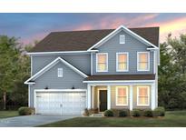 Charming two-story home boasts a well-manicured lawn and an attached garage, creating a welcoming curb appeal at 1401 Hollyview Ave, Durham, NC 27703