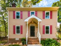 Charming two-story home with red shutters and inviting front porch at 3553 E Jameson Rd, Raleigh, NC 27604