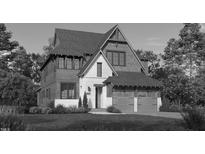 Charming two-story home with a well-manicured lawn, attached garage, and neutral paint scheme at 415 Englewood Dr, Chapel Hill, NC 27514