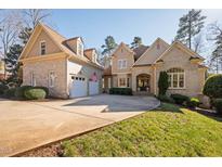 Charming home featuring stone accents, a two-car garage and a spacious driveway at 43 New Rhododendron, Chapel Hill, NC 27517
