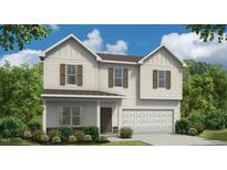 Charming two-story home featuring a symmetrical design, attached two-car garage, and inviting curb appeal at 6533 Winter Spring Dr, Wake Forest, NC 27587
