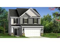 Charming two-story home featuring gray siding, a two-car garage, and a welcoming front porch at 135 Cameron Willow Way Way, Angier, NC 27501