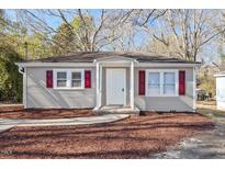 Charming single-story home with gray siding and a cozy front porch at 505 N Cypress St, Wendell, NC 27591