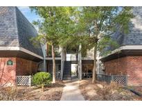 Two-story condo with brick accents, upper and lower balconies, and well-maintained landscaping at 108 Ephesus Church Rd # 510, Chapel Hill, NC 27517