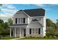 Charming two-story home with gray siding, black shutters, and inviting front porch at 1256 Hardin Hill Ln, Knightdale, NC 27545