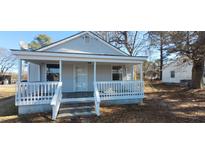 Charming single-story home with a cozy front porch and white railings at 1409 Mcdearman Ave, Rocky Mount, NC 27804