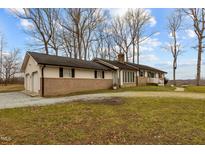 Charming single-story home featuring a brick facade and a two-car attached garage at 2144 Blalock Dairy Road, Roxboro, NC 27574