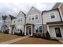 Charming townhomes with Craftsman-style architecture and inviting front entrances and drought resistant landscaping at 3195 Mission Olive Pl # 352, New Hill, NC 27562