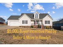 Charming one-story home with a manicured lawn and inviting front porch at 35 Henry Rifle Ln, Angier, NC 27501