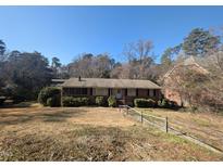 Charming brick home with a well-maintained lawn and landscaped front yard at 3501 Turnbridge Dr, Raleigh, NC 27609